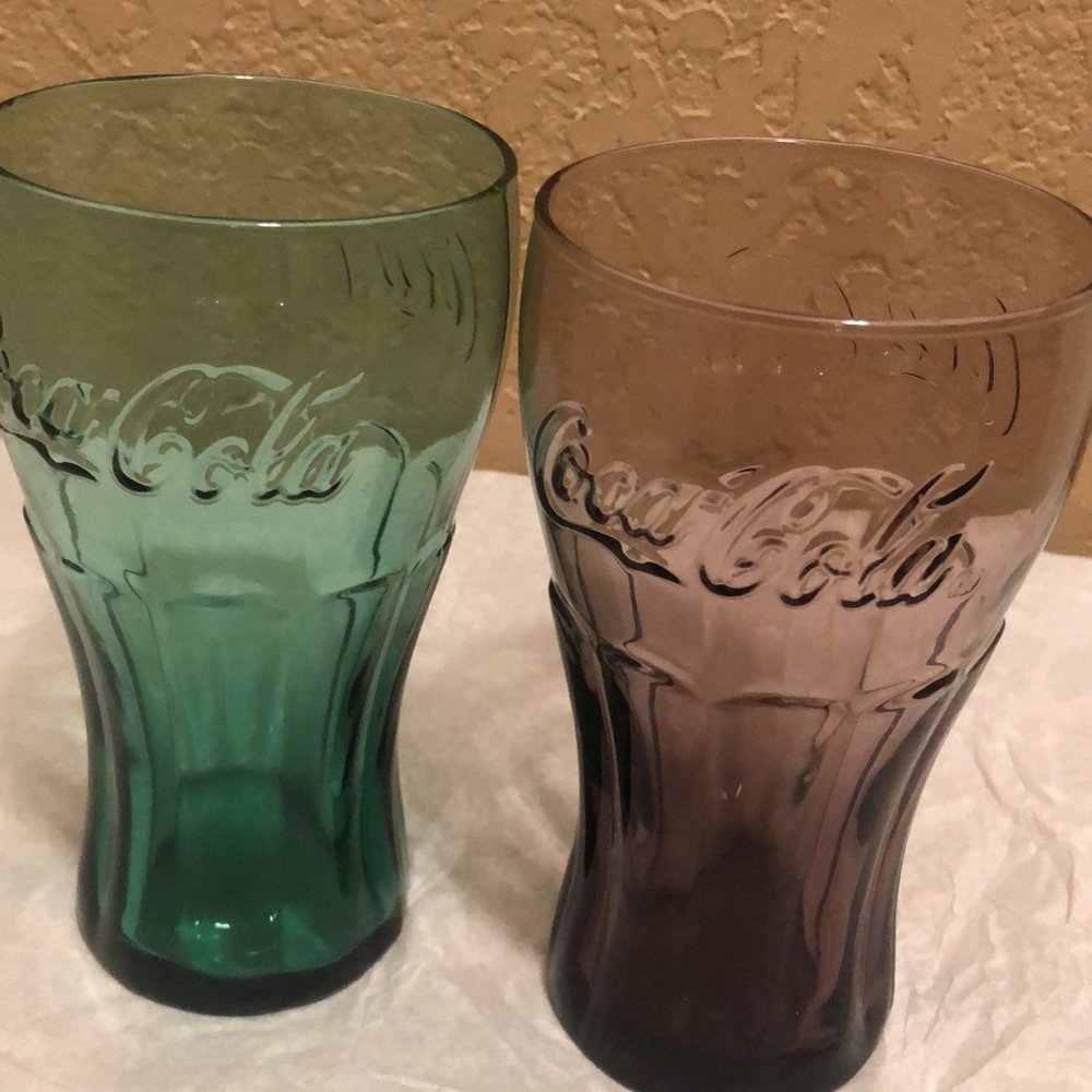 2 Vintage Coca Cola Glasses. 1 green & 1 purplish color. Very gently used.
